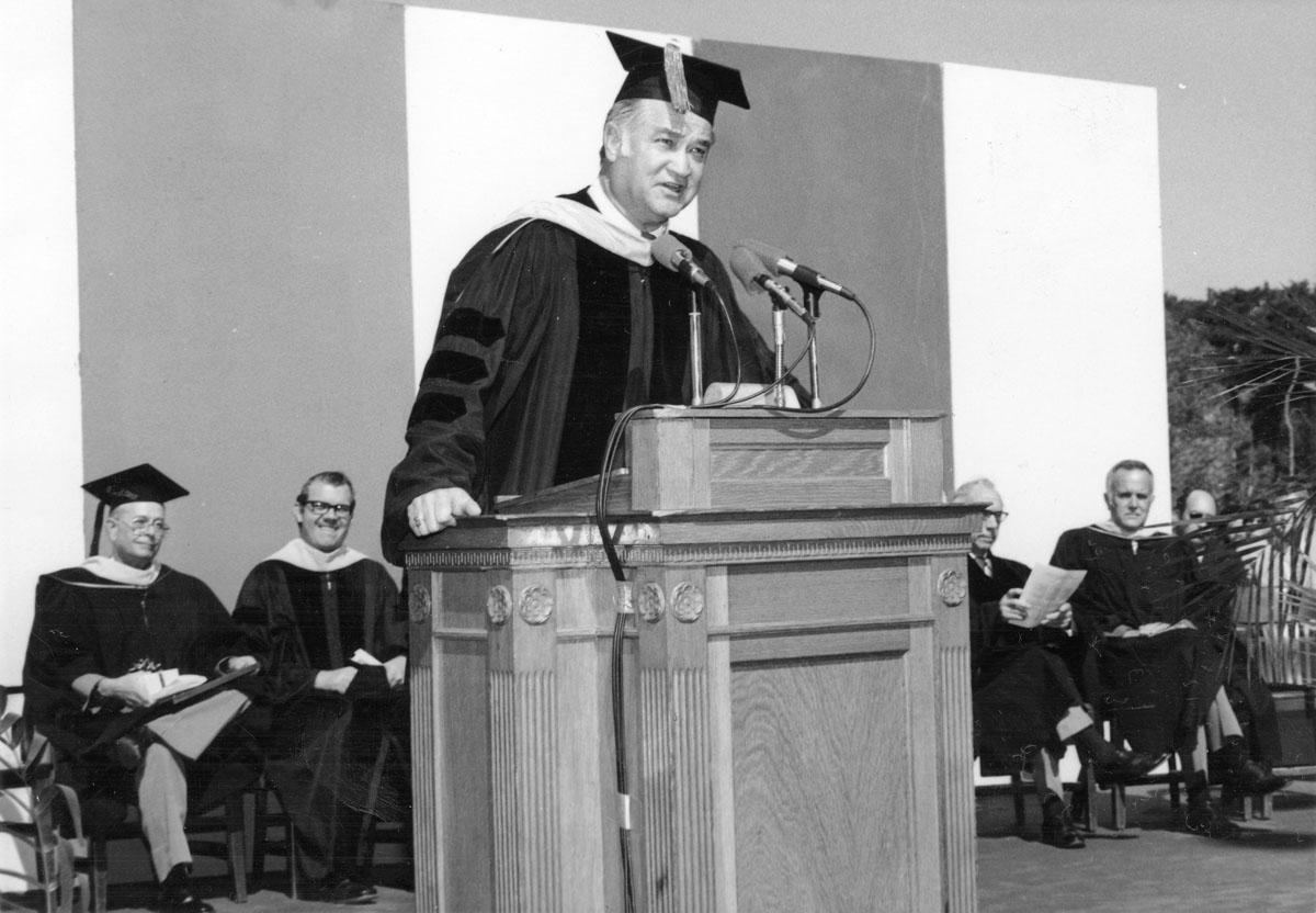 Robert Foster speaks at a commencement ceremony.