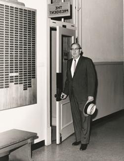 "Roll of Honor" Valk - Northwest's sixth president, J.W. 琼斯站在行政大楼他的办公室外. 第二次世界大战荣誉榜显示在右边. 荣誉勋章现在显示在沃克中心.