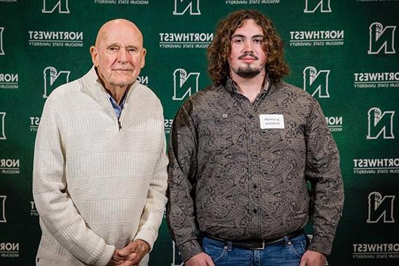 Jeremiah Dobbins (left) is pictured with Jim Skelton, son of Luther Skelton, at Northwest's Powering Dreams celebration of donors and scholars in September. (Northwest Missouri State University photo)