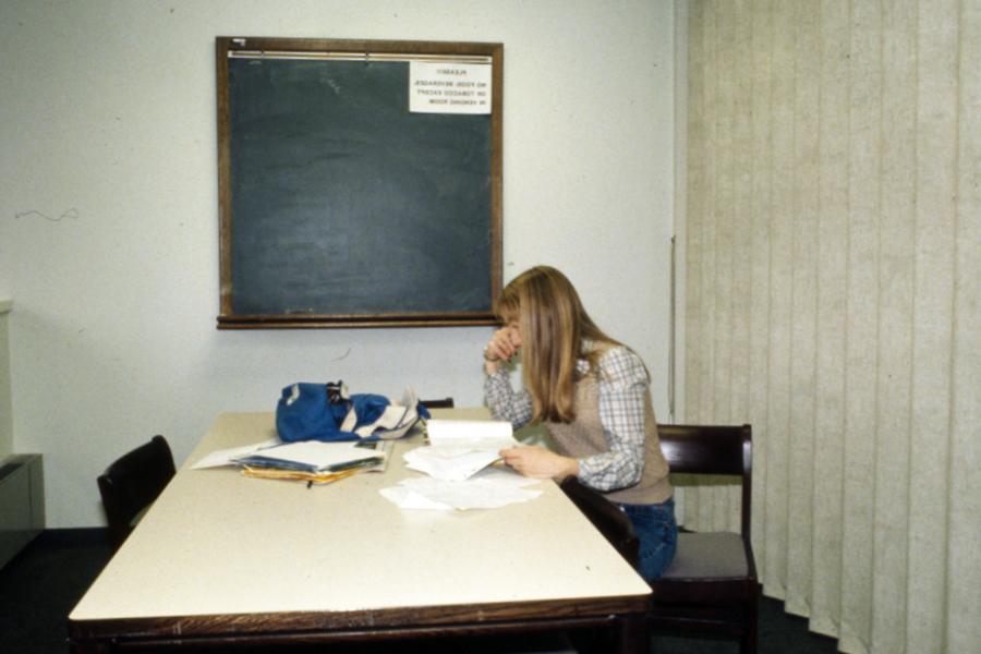 A student studies in the Owens Library during the 1980s. (University Archives)